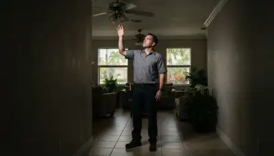 Lighting consultant assesses a dim ceiling corner during a Fort Lauderdale, FL home lighting consultation