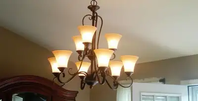 Classic ceiling chandelier installation with warm lighting in Fort Lauderdale, FL