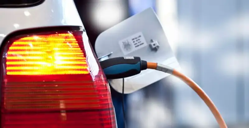 Electric car plugged into EV charger after professional installation in Fort Lauderdale, FL