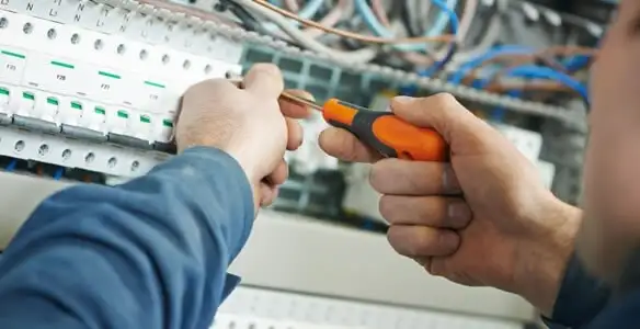 electrical service showing licensed electrician performing electrical panel maintenance and adjustments in Fort Lauderdale, FL