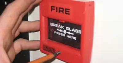 fire alarm installation service showing manual fire alarm pull station installed by licensed electricians in Fort Lauderdale, FL