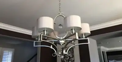 Modern chandelier installation with multiple light fixtures in Fort Lauderdale, FL