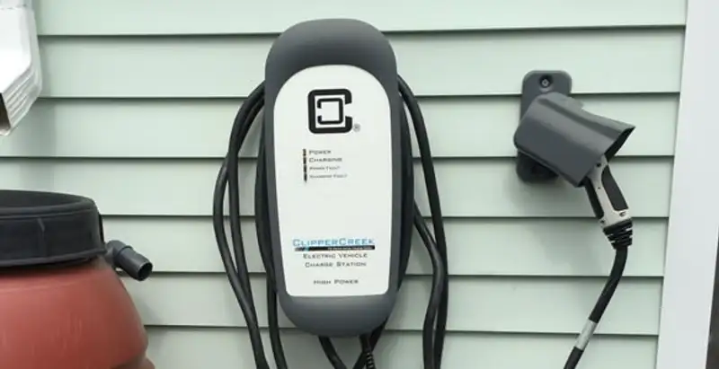 Outdoor electric vehicle charger installation on residential wall in Fort Lauderdale, FL