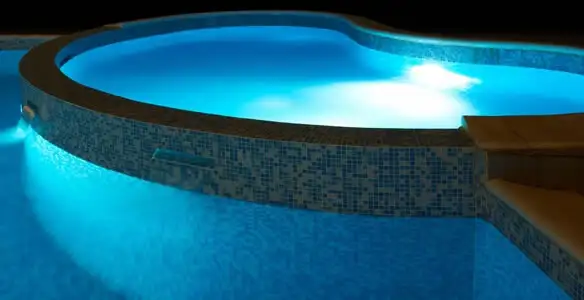 pool light installation and repair services highlighting illuminated pool interior lighting in Fort Lauderdale, FL