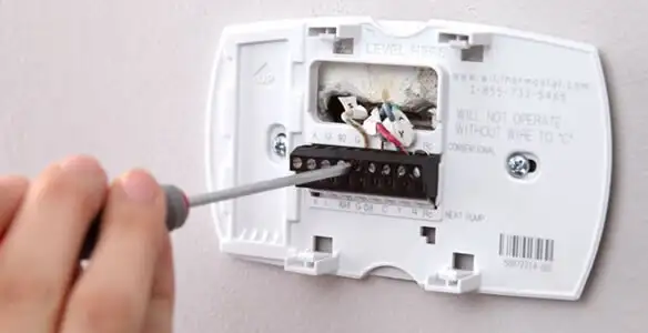 Thermostat installation service with proper wiring and secure wall mounting in Fort Lauderdale, FL