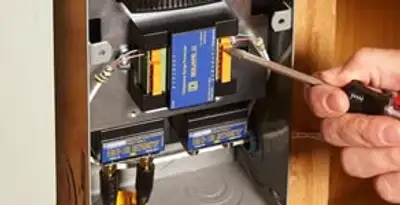 Whole home surge protection device being installed by a licensed electrician to protect electrical systems in Fort Lauderdale, FL